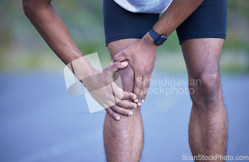 Image of Fitness, running and man in road with knee pain, sports cramp stop and workout on path. Outdoor exercise, health and wellness, runner and hand on leg injury for massage relief while marathon training
