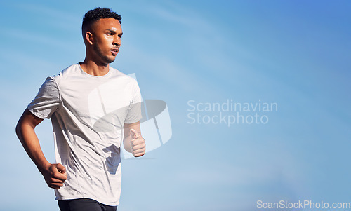 Image of Running, man and training in summer nature and outdoor exercise with athlete in healthy workout or mockup of fitness. Male, runner and motivation in morning cardio, sports or health goals on blue sky