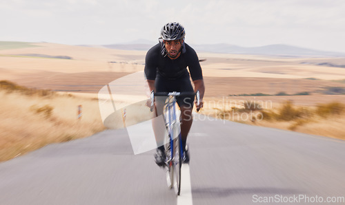 Image of Portrait, street and man on a bike for travel, countryside cycling or training for a competition. Serious, fitness and a male cyclist with a bicycle in the road for a race, adventure or nature cardio