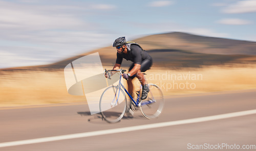 Image of Speed, nature and road, man on bicycle for workout, exercise and scenic mountain path. Health, wellness and cyclist on bike for morning training, practice and cycling race, blue sky and fast motion.
