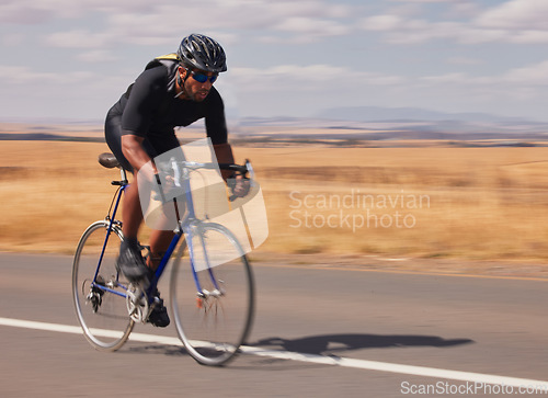 Image of Speed, nature and man cycling on road for workout, exercise and scenic mountain path. Fitness, wellness and cyclist on fast bike on summer morning for training, practice and bicycle race with motion.