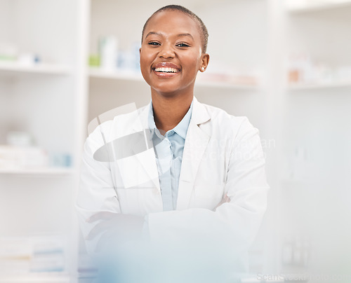 Image of Crossed arms, smile and portrait of black woman pharmacist working in chemist for medication dispensary. Happy, confident and African pharmaceutical worker in medicine pharmacy for healthcare career.