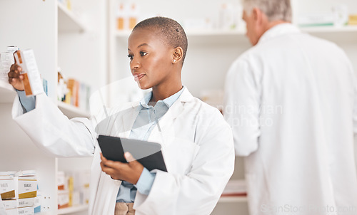 Image of Healthcare, pharmacy or black woman with a tablet, connection or research on medication or pill box for treatment. Medical, pharmaceutical or African person with tech, drugstore or check prescription