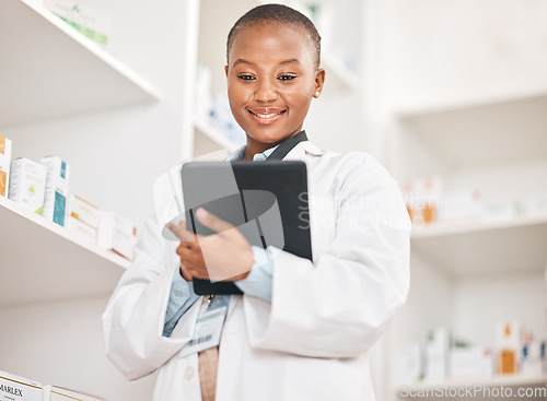 Image of Inventory, pharmacist and black woman with a tablet, research and typing with network, update inventory and stock. African person, employee or medical professional with technology, check prescription