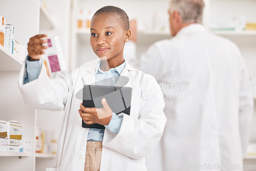 Image of Healthcare, pharmacist and black woman with a tablet, pill box and research on medication. Medical treatment, pharmaceutical and African person with technology, inventory and checking prescription