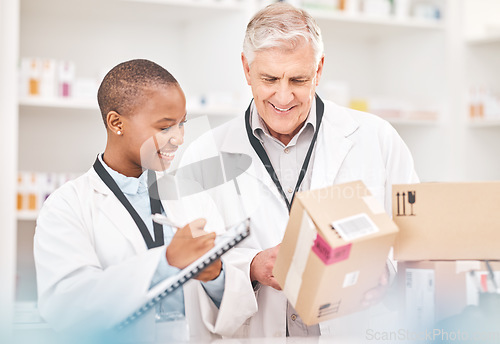 Image of Man, woman and boxes in pharmacy for checklist, delivery schedule or stock report for medicine. Help, mentor and pharmacist team with inventory list, pharmaceutical product package with medical info.