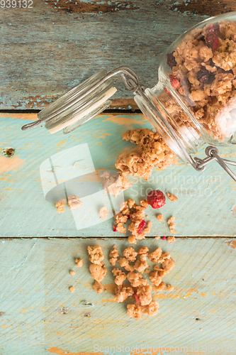 Image of Glass jar with healthy breakfast cereal 