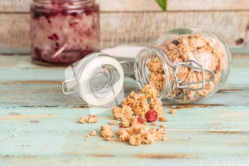 Image of Glass jar with healthy breakfast cereal 