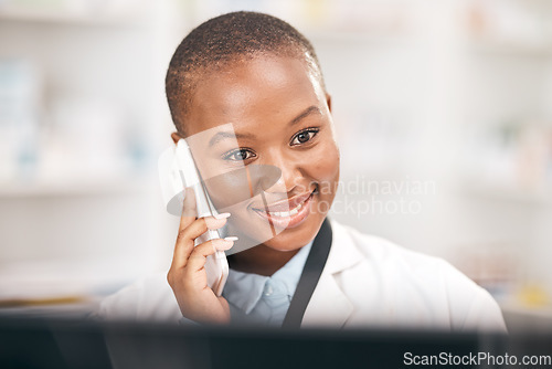 Image of Pharmacy, smile and woman talking on a phone call while reading information. African person or pharmacist on smartphone for telehealth, consultation or customer service and health care advice