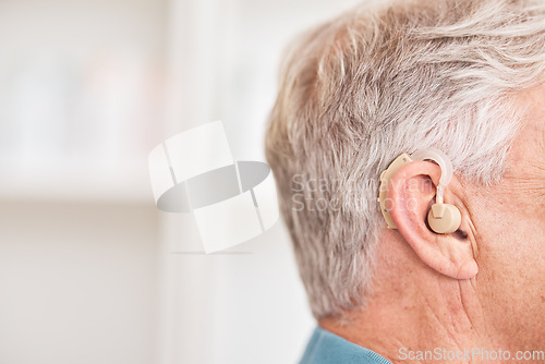 Image of Hearing aid, closeup and ear of man with disability for medical support, help listening or healthcare at mockup space. Face of deaf patient with audiology implant for sound waves, amplifier or volume
