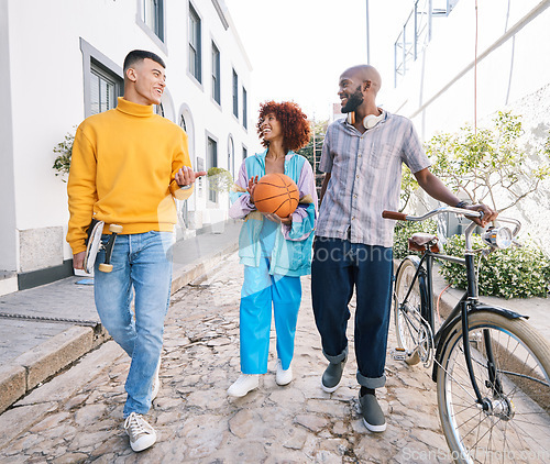 Image of People, city and friends walking and talking with a basketball and bicycle outdoor for travel and fun. Diversity, happiness and student group of men and woman for adventure and freedom on street