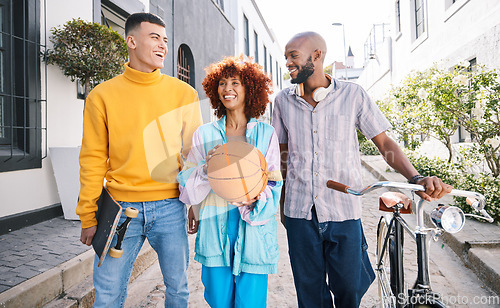 Image of People, city and friends walking outdoor with a basketball and bicycle for student travel and fun. Diversity, talking and group of men and woman laugh on funny adventure and freedom on urban street