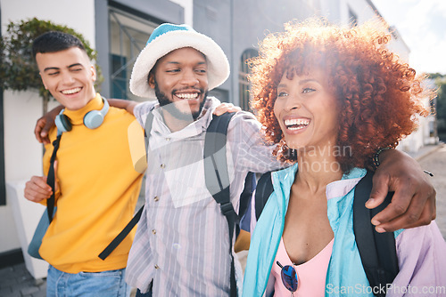 Image of Happy, university and friends walking in city, relax on holiday, adventure and weekend together. Travel, college students and men and women in urban town for bonding, conversation and fun on vacation