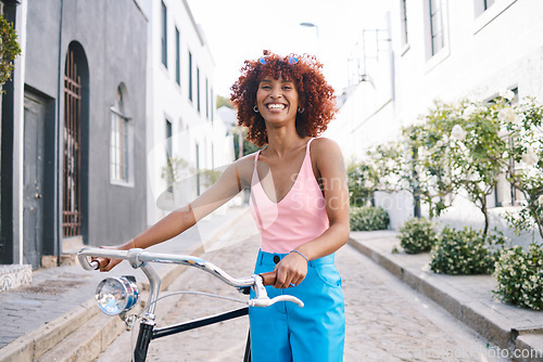 Image of Bike, gen z or portrait of happy woman cycling with street fashion in urban outdoor activity on holiday. City girl, streetwear and sustainable transport, carbon neutral travel on bicycle in road