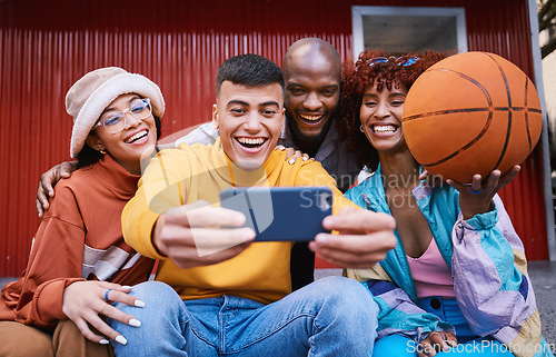 Image of Selfie, basketball and friends in the city together taking a profile picture for fashion or urban style. Smile, social media and ball with a youth diversity group taking a mobile photograph in town