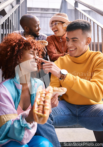 Image of Hotdog, friends and people eating outdoor for travel, funny laugh and fun on stairs. Diversity, happiness and gen z group of men and women with food on date, adventure and touch nose in urban town