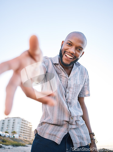 Image of Portrait, happy black man and helping hand, offer and invitation outdoor in low angle mockup. Smile, palm and African person giving assistance in support, care and acceptance of handshake to welcome