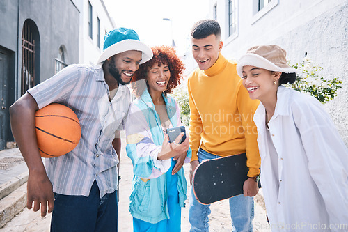 Image of Gen z group, phone and city with laugh, meme and streaming on social network, blog and happy in street. Student friends, men and women with smartphone, comic video or post on web in Los Angeles metro