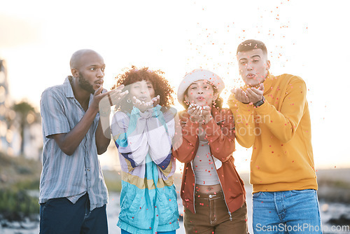 Image of Friends, outdoor and people blowing confetti outdoor for celebration, motivation and fun. Diversity, happiness and group of men and women for adventure, party and happy youth with freedom in nature