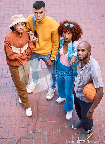 Image of Friends, city and portrait with basketball outdoor for sport, cool fashion and serious pose. Diversity, gen z and student group of men and woman for adventure and youth on urban street from above