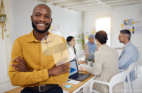 Image of Black business man, arms crossed and leader at meeting, company or ceo with pride, portrait and success. Young African entrepreneur, boss and startup manager with smile, group and workshop at agency