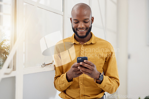Image of Business, happy black man and typing with phone in office for social network, mobile website and internet contact. Employee scroll on smartphone chat, reading news app and notification of information
