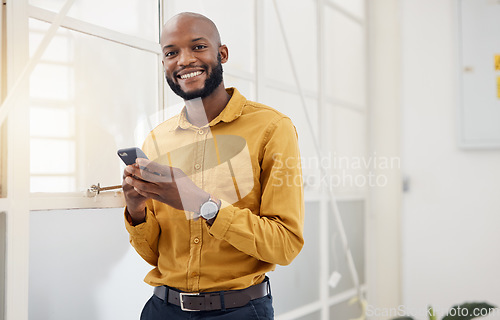 Image of Happy black man, portrait and typing on smartphone in office for social media, networking and mobile contact. Business employee with phone, reading tech notification and information with digital chat