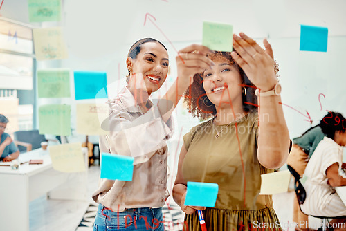 Image of Women, brainstorming and teamwork, sticky note and meeting with objectives and agenda at creative startup. Communication, glass board and collaboration, research and ideas, discussion and strategy