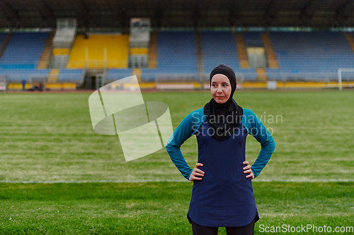 Image of A Muslim woman with a burqa, an Islamic sportswoman resting after a vigorous training session on the marathon course. A hijab woman is preparing for a marathon competition