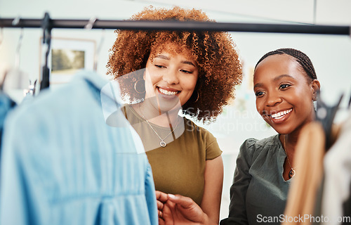 Image of Fashion, shopping and women in a boutique for clothes, inspection and retail customer. Happy, together and girls, employees or designers showing clothing in a store for a sale, choice or ecommerce