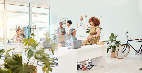 Image of Coworking, teamwork or women talking for fashion design, planning or draft for small business clothing line. People, collaboration or designer speaking to mature mentor for advice in internship