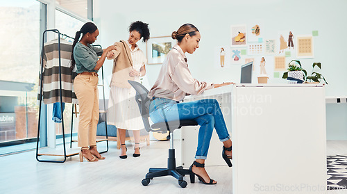 Image of Office, typing or woman with laptop for fashion design, plan or online draft for small business clothing line. Smile, computer or happy designer in workplace to research clothes on blog for project