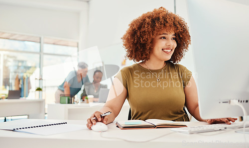 Image of Computer, fashion and design with a business woman at work in her office for modern or artistic style. Smile, workshop and technology with a happy young designer working in a creative studio