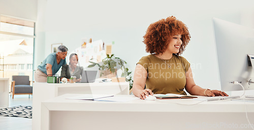 Image of Computer, fashion and creative with a designer woman at work in her office for modern or artistic style. Smile, workshop and technology with a happy young .employee working in a design studio