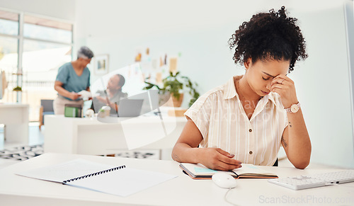 Image of Anxiety, headache and a business woman writing in her notebook while working to a deadline in the office. Stress, depression and compliance with a young fashion designer planning an artistic project