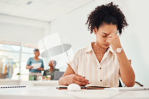 Image of Stress, headache and a business woman writing in her notebook while working to a deadline in the office. Anxiety, depression and compliance with a young fashion designer planning an artistic project