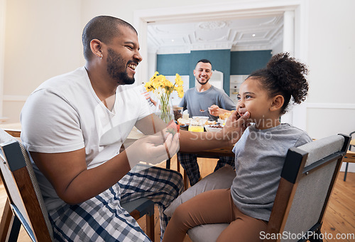 Image of Gay couple, breakfast or child with father wipe, cleaning or remove food, morning meal or cereal from mouth of girl. Happy family, adoption or non binary dad smile for hungry youth kid eating at home