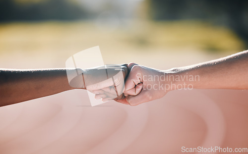 Image of Closeup, fitness and fist bump for sports support, motivation and goal in training. Stadium, together and people with a gesture or hands for workout or exercise solidarity for a race or competition