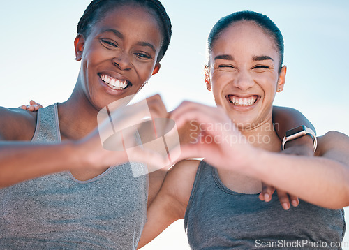 Image of Friends, fitness and portrait, women with heart hands and emoji, wellness and health, support and love sign outdoor. Happiness, care and exercise, cardio and sports, healthy and workout together