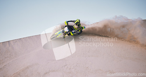 Image of Bike, sand and space with a sports man riding a vehicle in the desert for adventure or adrenaline. Motorcycle, training and dust with an athlete on mockup in nature for power or active competition