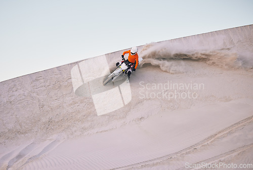 Image of Bike, sand and mockup with a sports man riding a vehicle in the desert for adventure or adrenaline. Motorcycle, training and speed with an athlete on space in nature for power or active competition