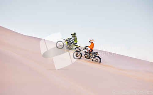 Image of Dune, off road race and men on motorbike together for practice, training and extreme sports energy. Professional dirt biking challenge, friends and danger with motorcycle competition on desert hill.