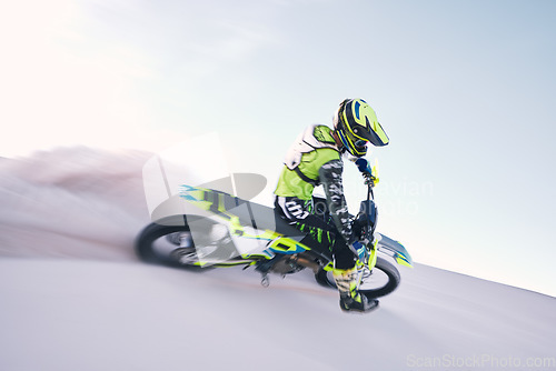 Image of Bike, dust and speed with a sports man riding a vehicle in the desert for adventure or adrenaline. Motorcycle, training and freedom with an athlete on sand in nature for power or active competition