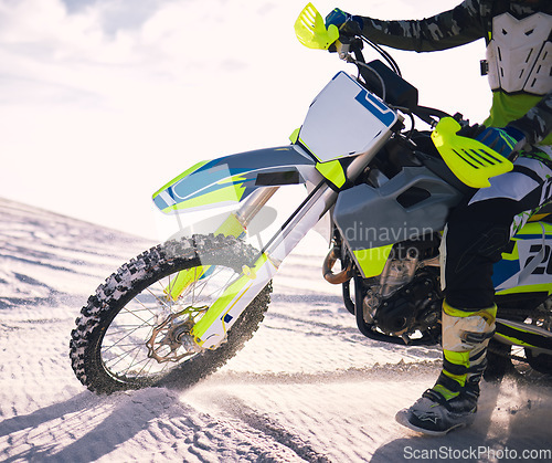 Image of Sports, desert and person on motorbike in nature for training, workout and challenge on sand. Extreme transport, travel and closeup of cyclist with motorcycle for adventure, freedom and adrenaline