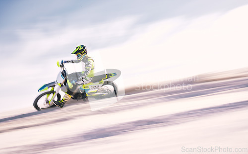 Image of Bike, mockup and motion blur with a man on sand riding a vehicle in the desert for adventure or adrenaline. Motorcycle, freedom and training on space with an athlete on space in nature for power
