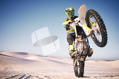 Image of Bike, sand and balance with a man on mockup riding a vehicle in the desert for adventure or adrenaline. Motorcycle, training and freedom with an athlete on space in nature for power or competition