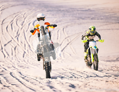 Image of Dune, desert race and men on motorbike together for practice, training and extreme sports energy in nature. Professional dirt biking challenge, friends and danger with off road motorcycle competition