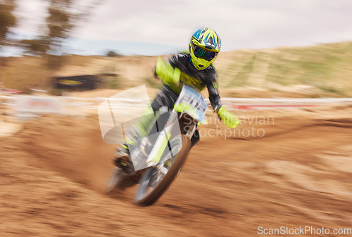 Image of Dirt, motion blur and motorbike cycling for sports, agile driving and off road adventure for speed, power or performance. Motorcycle, rally and driver in fast race, challenge or action on sand course