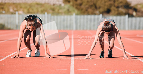 Image of Woman, running and start in sports competition, race or fitness on outdoor stadium track together. Female person or people in preparation for run, marathon or sprint in team practice or training