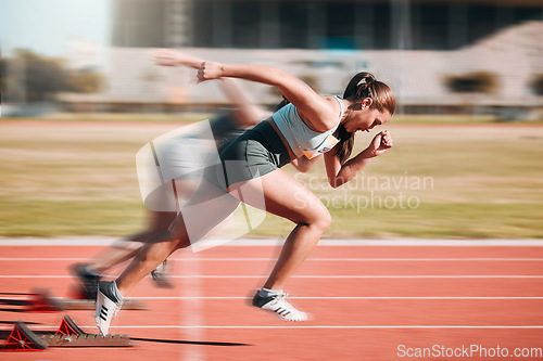 Image of Action, speed and women athlete running sprint in competition for fitness game and training for energy wellness on a track. Sports, stadium and athletic people or runner exercise, speed and workout